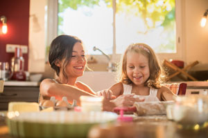 Mother and daughter cooking